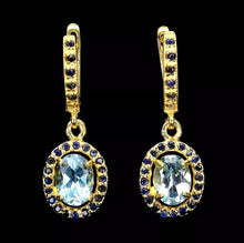 Load image into gallery viewer, Sky Blue Topaz and Gold Sapphire Hoops