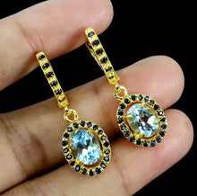 Load image into gallery viewer, Sky Blue Topaz and Gold Sapphire Hoops