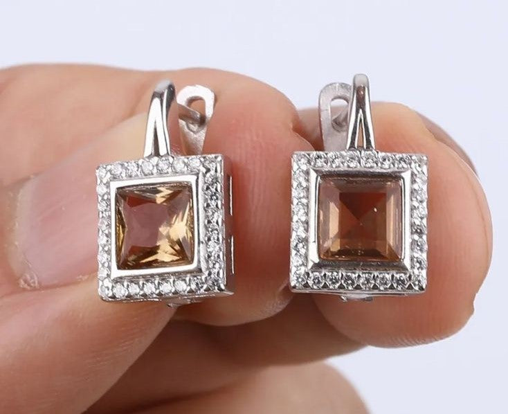 Aros Alexandrita y Topacio Blanco